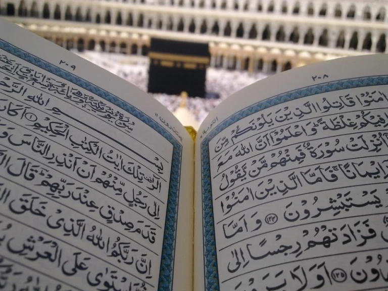 quran with kaaba in the background